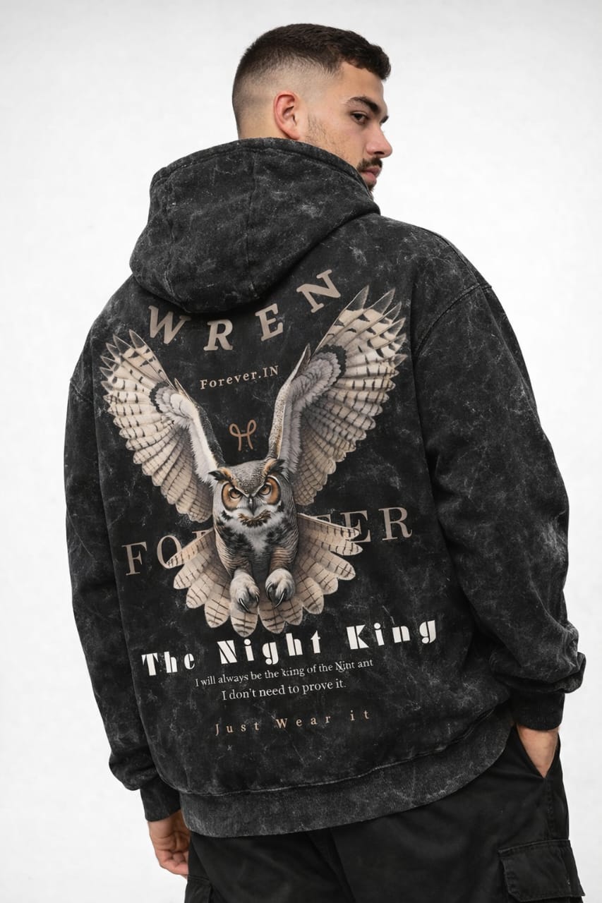 Person wearing a hoodie with an owl design and text on the back, on a white background